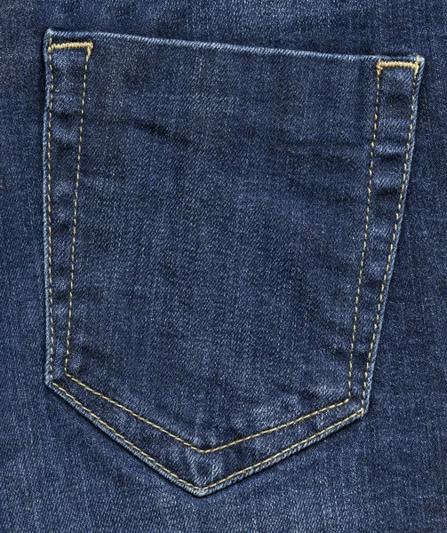 Blue jeans back pocket on denim background — Stock Photo, Image