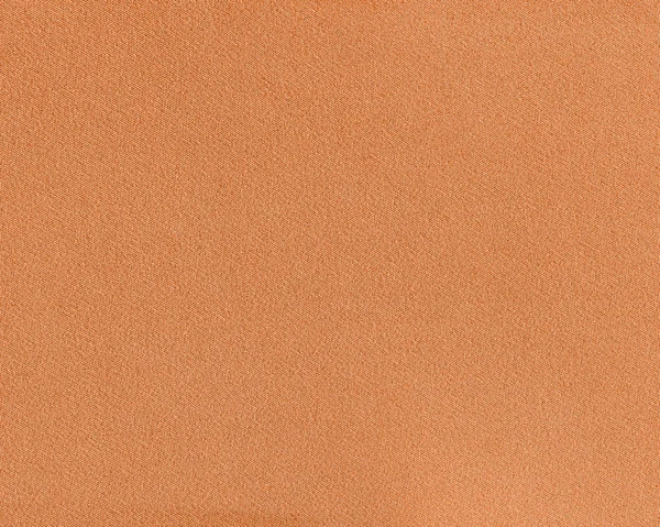 Текстура оранжевой ткани в качестве фона для дизайнерских работ — стоковое фото
