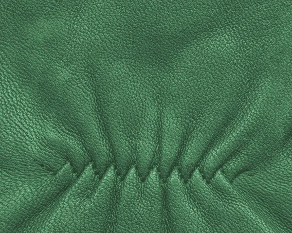 Grüner Lederhintergrund, Ziernaht — Stockfoto