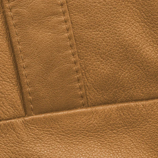 Yellow leather background,seam,stitches — Stock Photo, Image