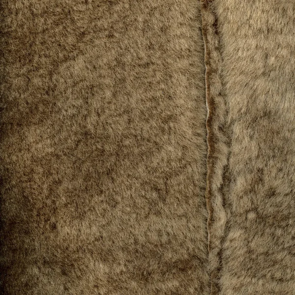 Brązowy futro naturalne tekstura zbliżenie, szew — Zdjęcie stockowe