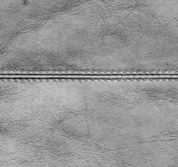 Alte weiße Lederhintergrund mit einer Naht verziert — Stockfoto