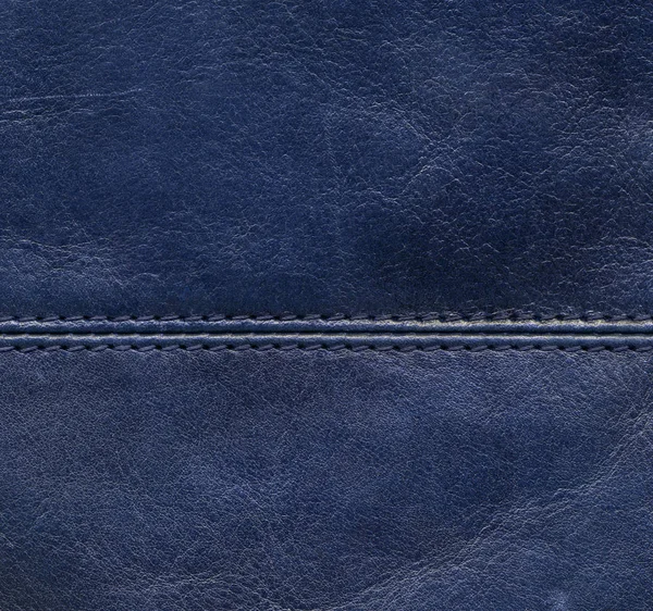 Blue leather background decorated with a seam — Stock Photo, Image