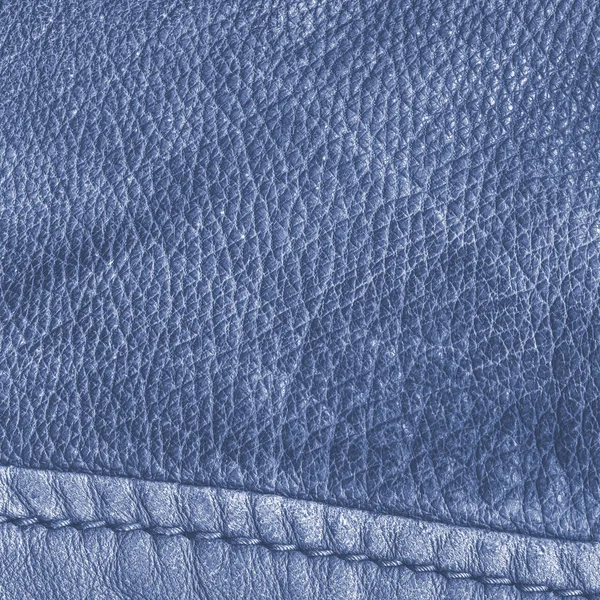 Blue leather texture decorated with a seam — Stock Photo, Image