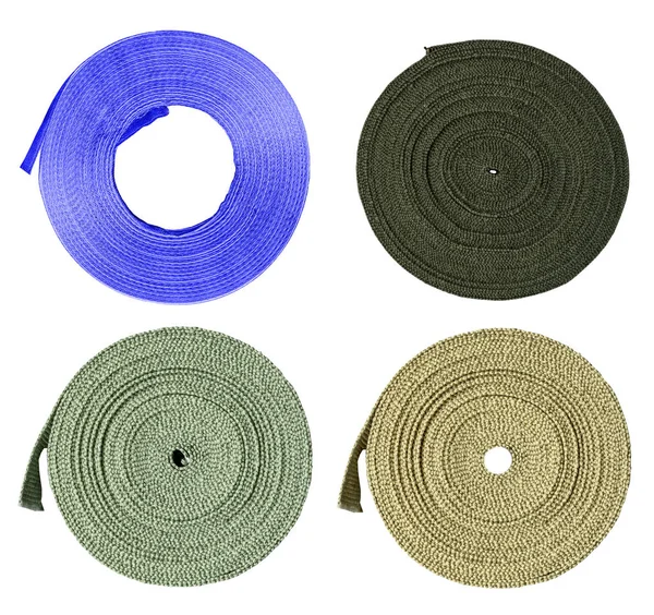 Four textile tapes of different colors on white background — Stock Photo, Image
