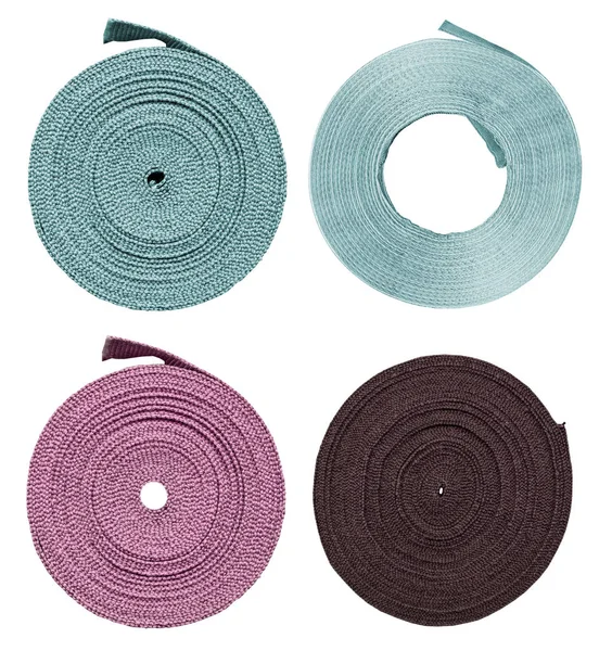 Four textile tapes of different colors on white background — Stock Photo, Image