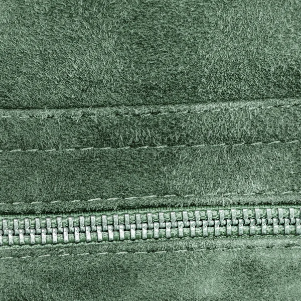 Green roughly dressed leather texture, zipper — Stock Photo, Image