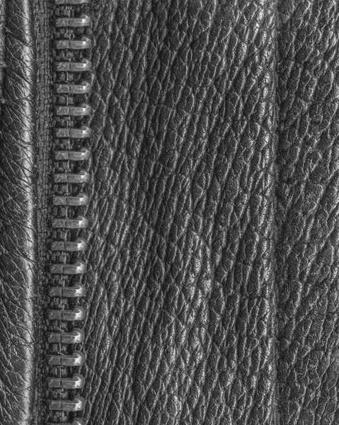 Zwart leder texture versierd met een rits-closeup — Stockfoto