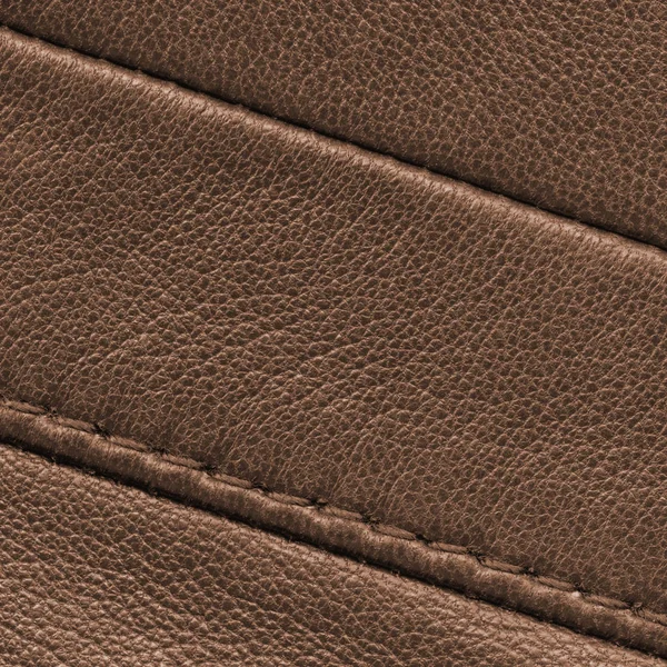 Textura de cuero marrón con costuras primer plano — Foto de Stock