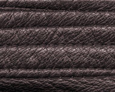 kahverengi deri doku dikiş ile dekore edilmiştir.