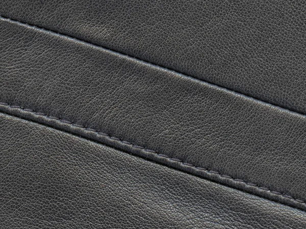 Texture in pelle nera decorata con cuciture . — Foto Stock