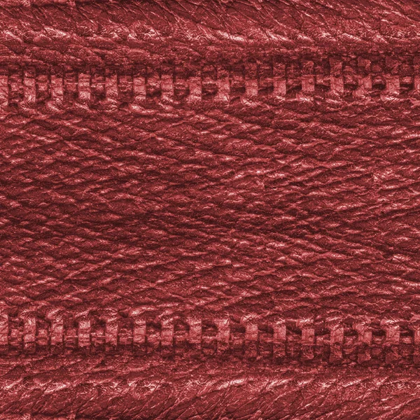 Red leather texture decorated with two zippers — Stock Photo, Image