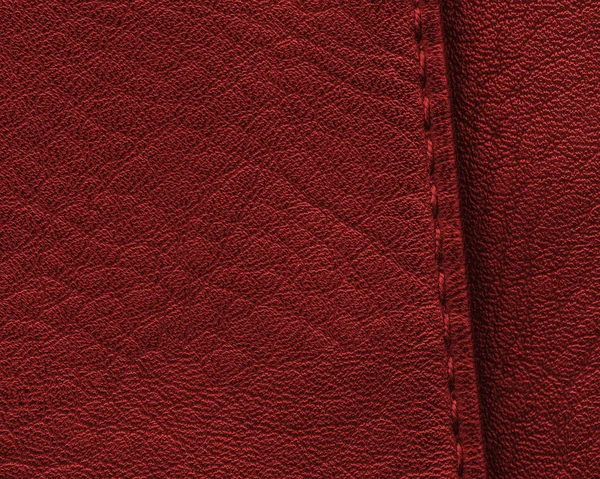 Texture in pelle rosso scuro primo piano, cucitura — Foto Stock