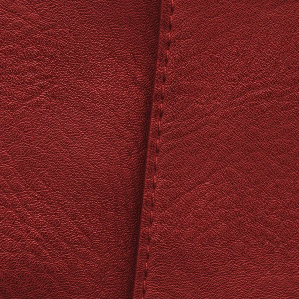 Red leather texture, a seam — Stock Photo, Image