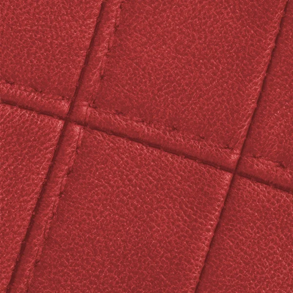 Czerwony skórzany tekstura ozdobione szwy — Zdjęcie stockowe