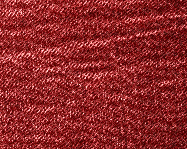 Текстура красной джинсы в качестве фона — стоковое фото