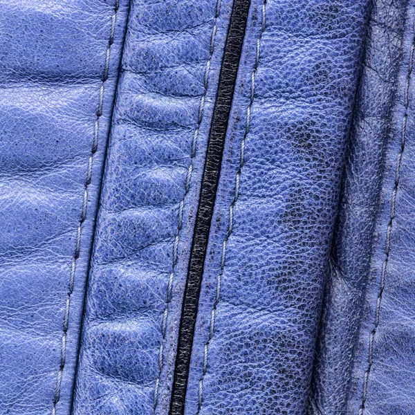 Fragment van blauw lederen kleding — Stockfoto