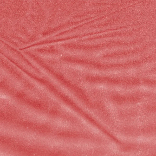 Light red crumpled synthetic material texture closeup. — Stock Photo, Image