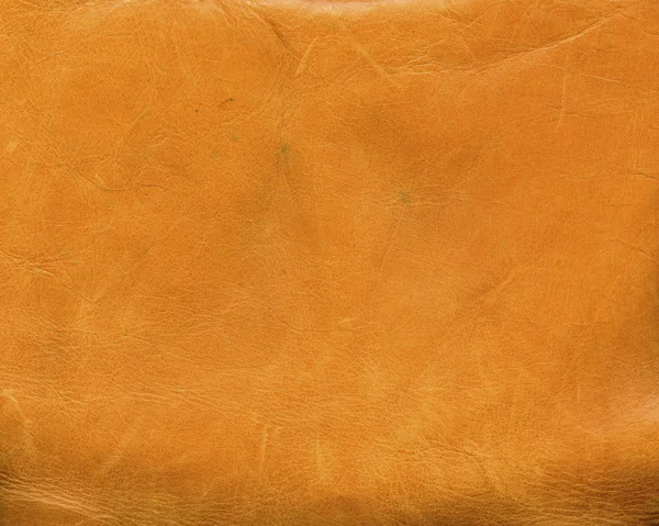 Stary żółty skórzany tekstura zbliżenie jako tło — Zdjęcie stockowe