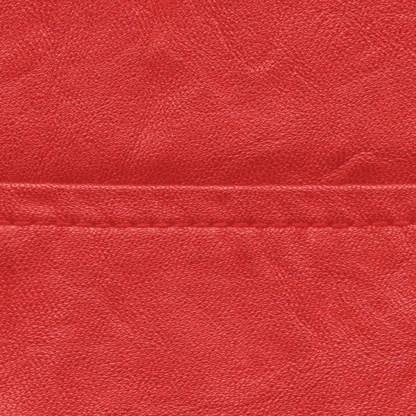 Red leather background decorated with a seam — Stock Photo, Image