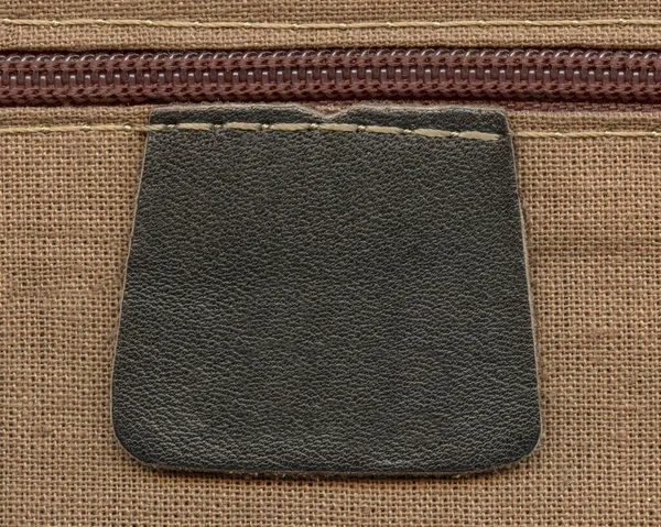 Blank black leather label, zipper closeup — Stock Photo, Image
