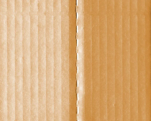 Κίτρινο κυματοειδές χαρτί δύο αποχρώσεις ως φόντο — Φωτογραφία Αρχείου
