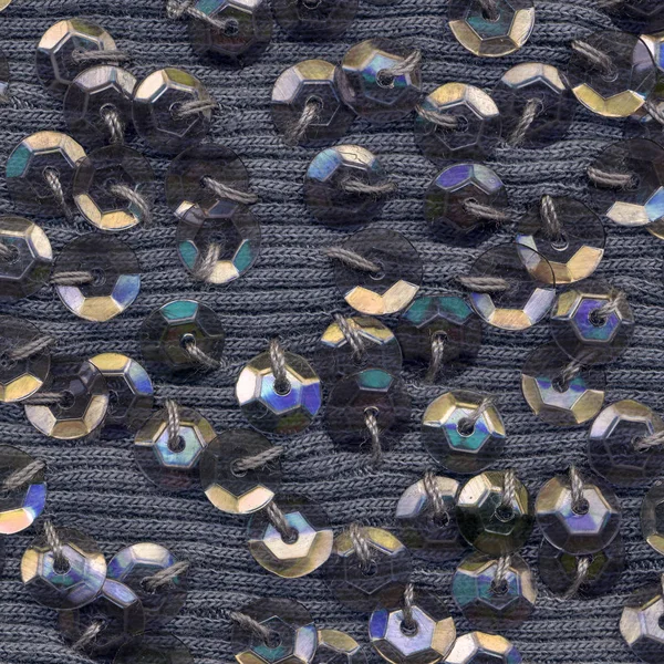 Tekstil arka plan üzerinde renkli pullu — Stok fotoğraf
