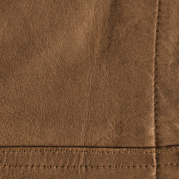 Brown leather background decorated with seams — Stock Photo, Image