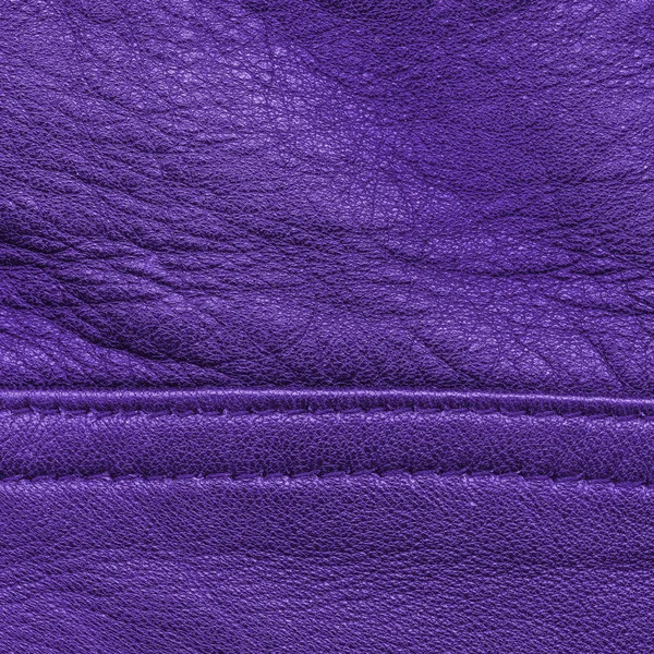 Lila läder texture, söm. Användbar som bakgrund — Stockfoto