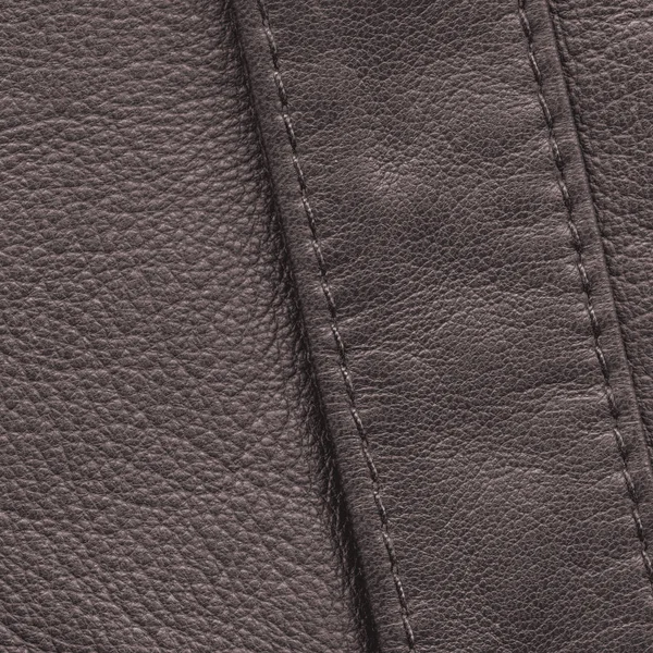 Brown leather background decorated with seams,stitches — Stock Photo, Image