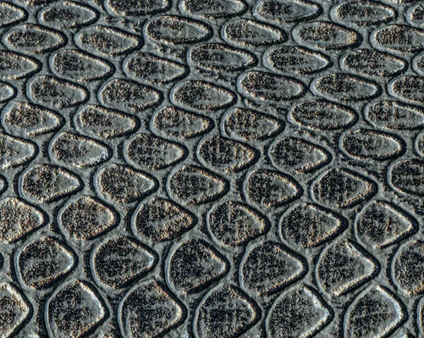 Svart konstgjord orm hud textur närbild — Stockfoto