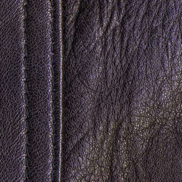 老和暗紫色皮革背景 — 图库照片