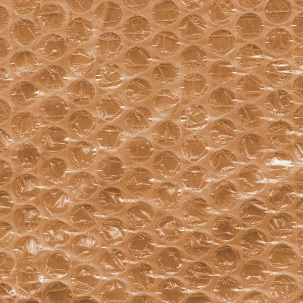 Texture cellophane giallo-marrone. Utile per lo sfondo — Foto Stock