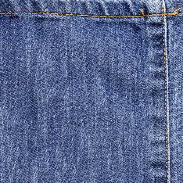 Background of blue denim texture decorated with seams — Stock Photo, Image