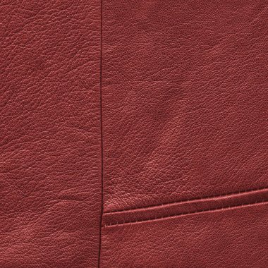 kırmızı deri arka plan dikişleri ile dekore edilmiştir. 