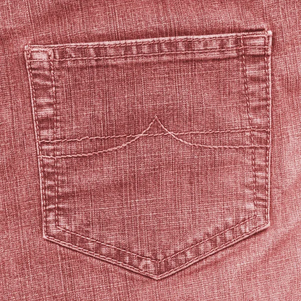 Red jean back pocket on jean background — Stock Photo, Image