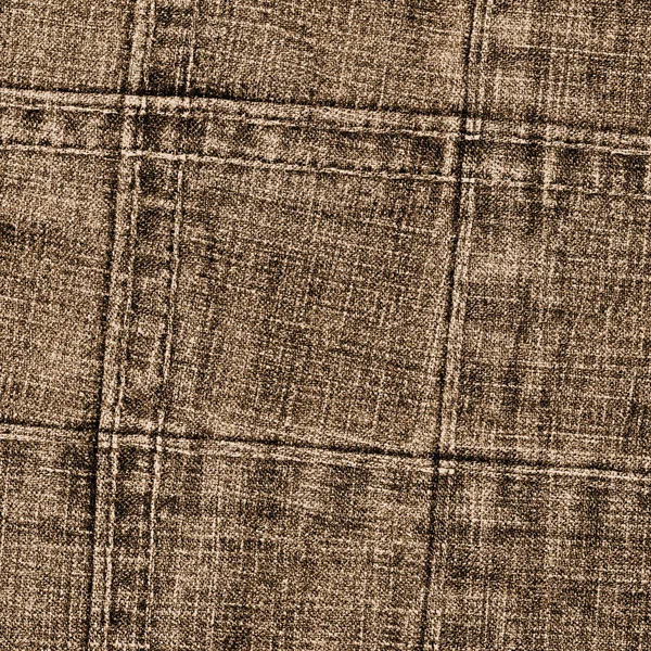 Фон из коричневой джинсовой текстуры, украшенный швами — стоковое фото