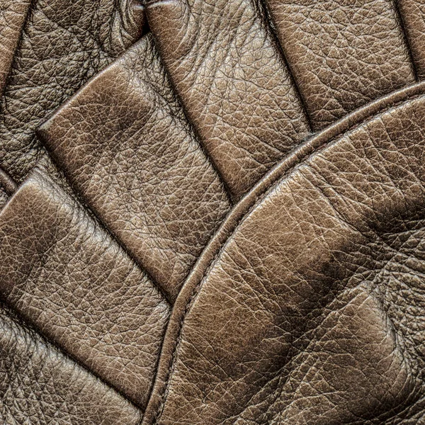 Fragment of leather coat as brown leather background — Stock Photo, Image