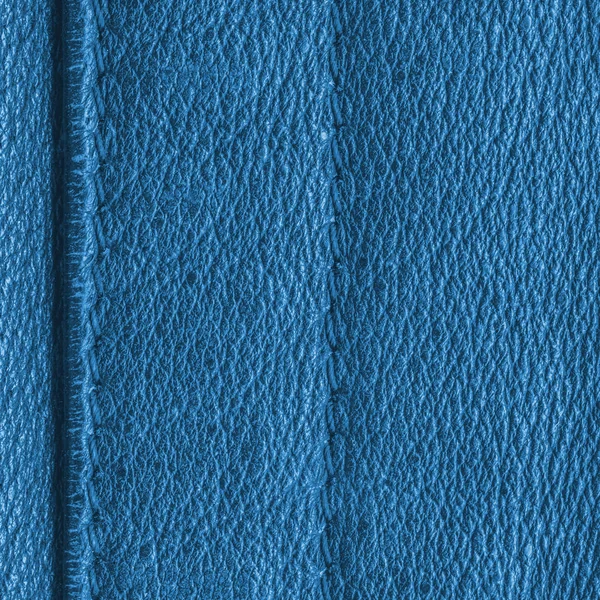 Skórzane niebieskie tło ozdobione szwy — Zdjęcie stockowe