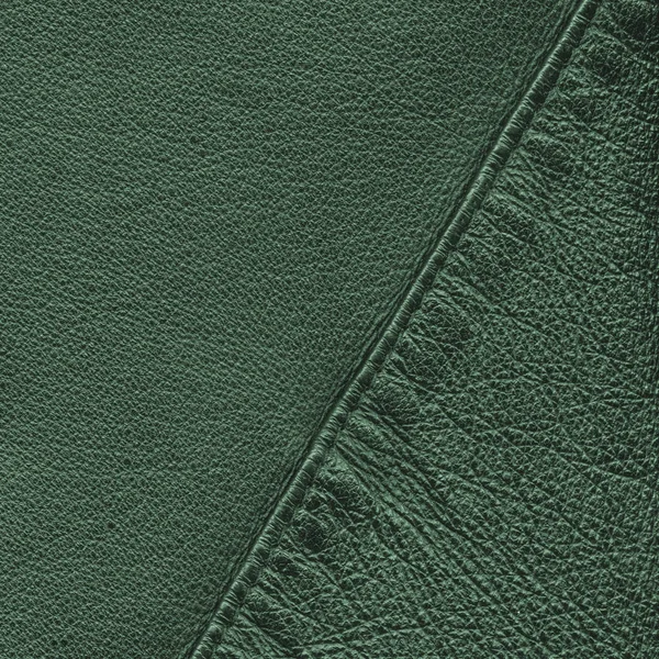 Fundo de couro verde decorado com uma costura — Fotografia de Stock