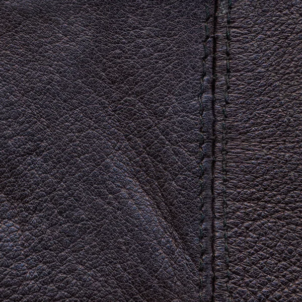 Old violet leather background decorated with a seam — Stock Photo, Image