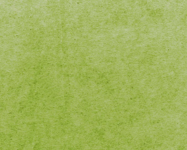 Текстура окрашенной зеленой упаковки бумаги крупным планом — стоковое фото