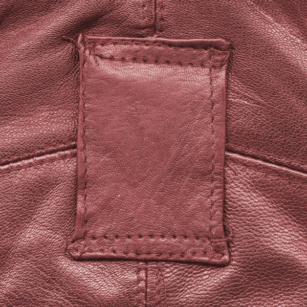 Fragment of red leather jacket as background — Stock Photo, Image