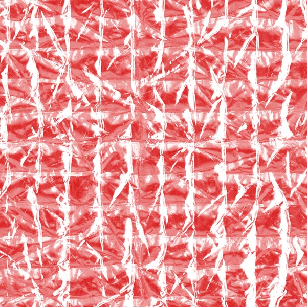 Текстура червоної фольги крупним планом. Може використовуватися як тло — стокове фото