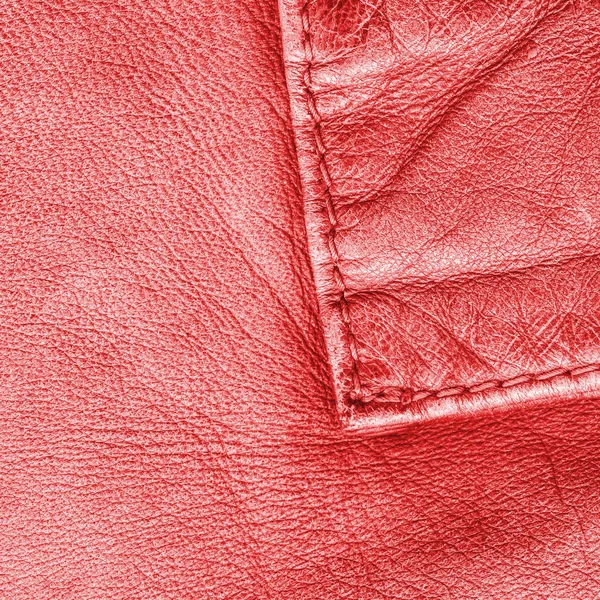 Fragment of red leather coat as background — Stock Photo, Image