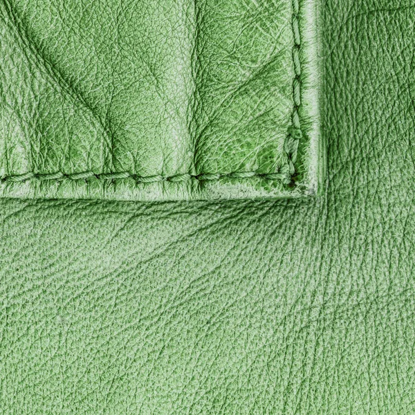 Fragment of green leather coat as background — Stock Photo, Image