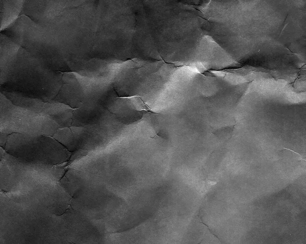 Old black crumpled paper texture closeup — Stock Photo, Image
