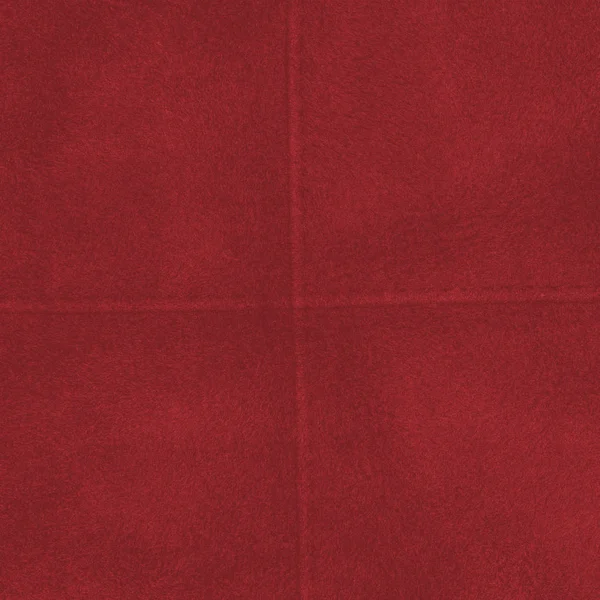 Red artificial fur texture, seams in shape of the cross — Stock Photo, Image