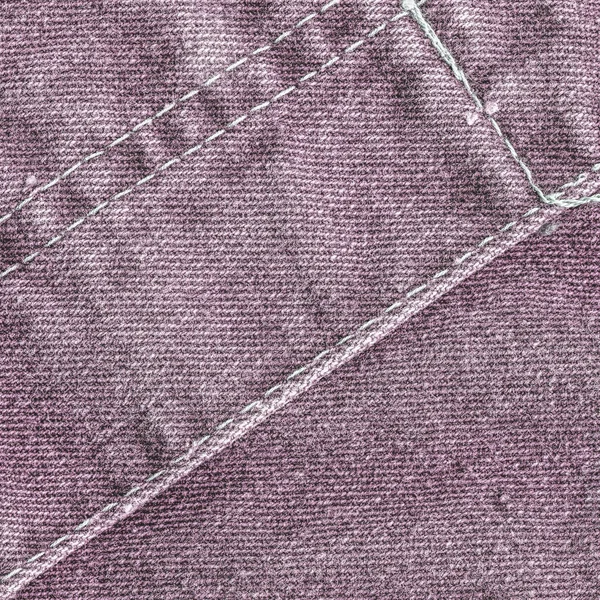 Fondo jean violeta decorado con costuras —  Fotos de Stock