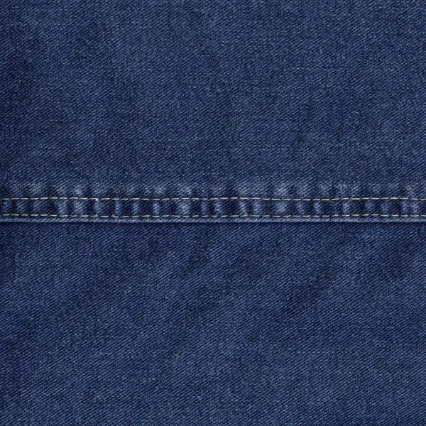 Blue denim texture decorated with a seam — Stock Photo, Image